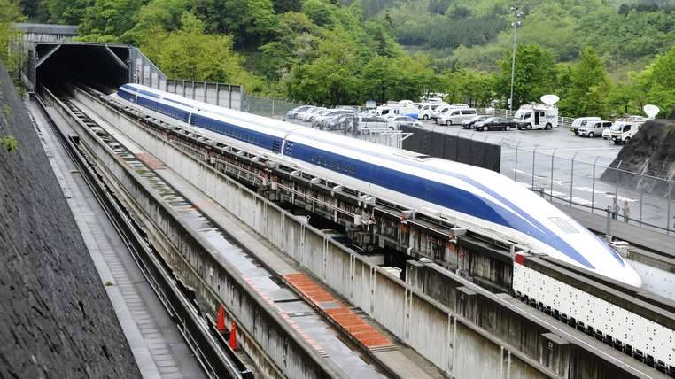 The Maglev (magnetic levitation) train speeds during a test run on the experimental track in Tsuru, 100km west of Tokyo, on May 11, 2010. US Transportation Secretary Ray LaHood took a test ride on Japan's super-fast magnetic train, a contender for President Barack Obama's multi-billion-dollar national railway project. Japan is up against China, France, Germany and other bidders as it seeks to sell its "Shinkansen" bullet and magnetic trains for the 13-billion-USD US high-speed national rail grid. AFP PHOTO/Toru YAMANAKA (Photo credit should read TORU YAMANAKA/AFP/Getty Images)