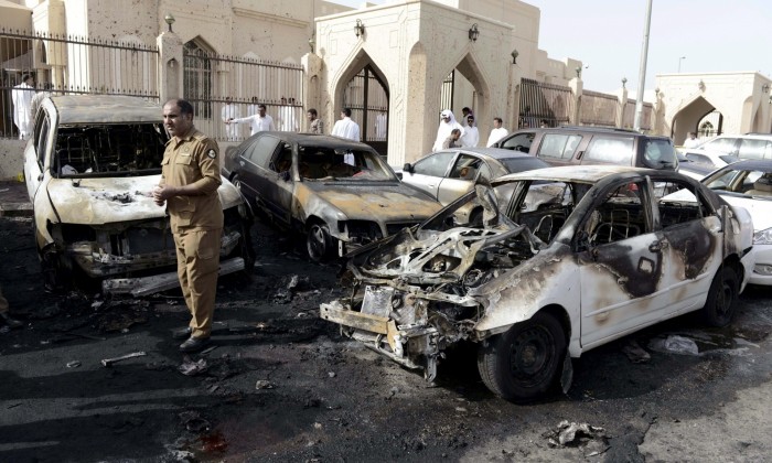 A policeman carries out an inspection after the explosion at the al-Anoud mosque. Photograph: Faisal al-Nasser /Reuters
