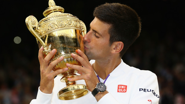 Novak Djokovic of Serbia celebrates with the trophy after winning the Final Of The Gentlemen's Singles