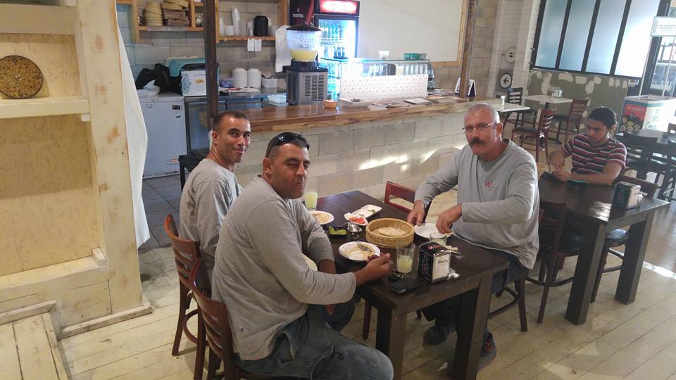 Muslims and Jews sharing meal together in Hummus cafe in Israel.