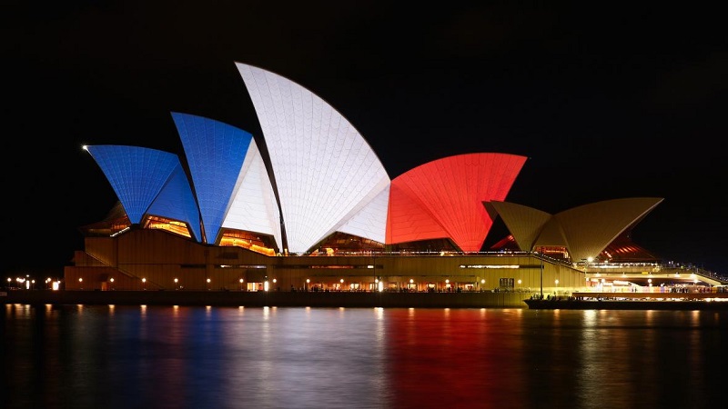 The “sails” of the Sydney Opera House are illuminated in the colors of the French flag on Saturday, Nov. 14, 2015 in Sydney, Australia. At least 120 people have been killed and over 200 are injured in Paris following a series of terrorist acts in the French capital on Friday night.