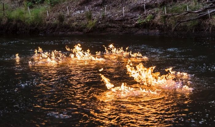 Australian Greens MP Jeremy Buckingham posted a video of himself lighting Queensland's Condamine River on fire. He blames a nearby fracking site. (Photo courtesy: Jeremy Buckingham)