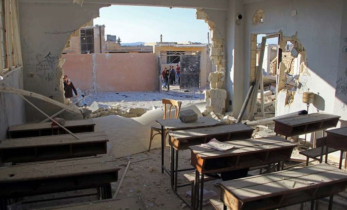 A school classroom was damaged and 22 students and six teachers killed in an air strike in rebel-held Idlib province. Photo: Omar Haj Kadour, AFP/Getty Images